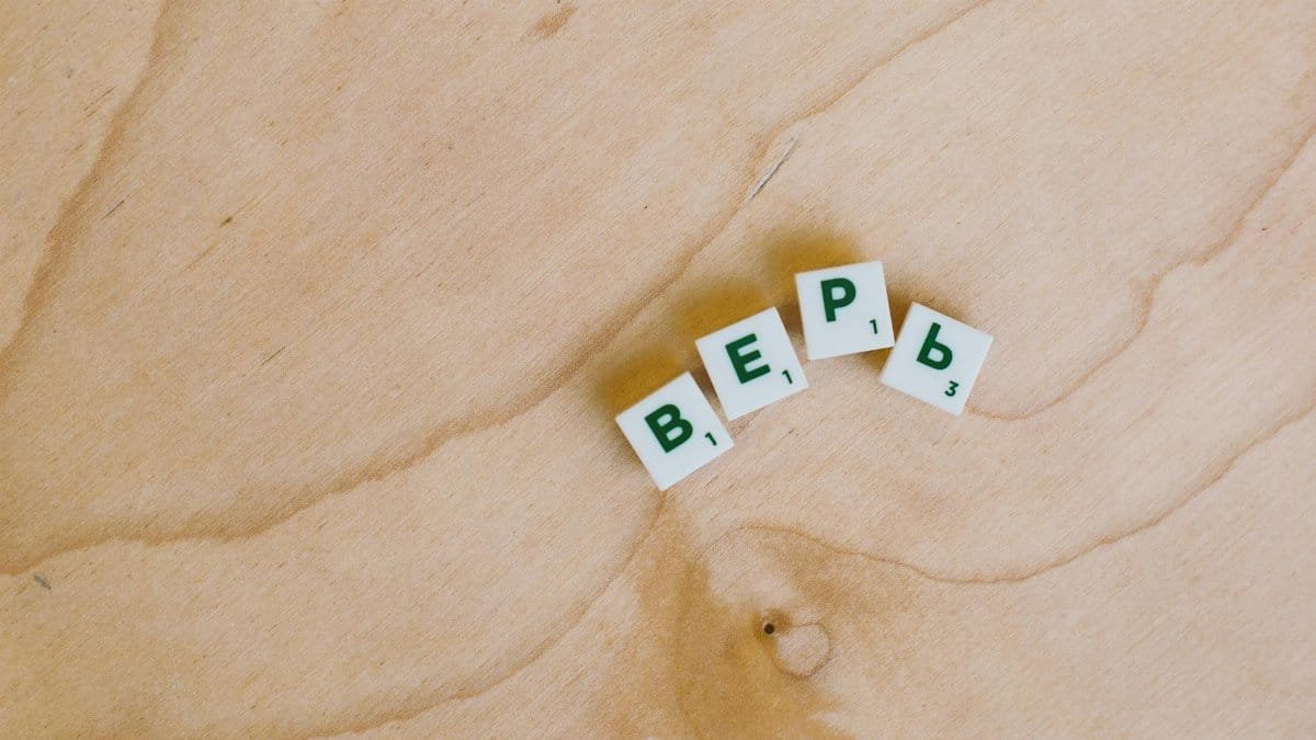 Cyrillic alphabet tiles spelling a word on a smooth wooden surface.