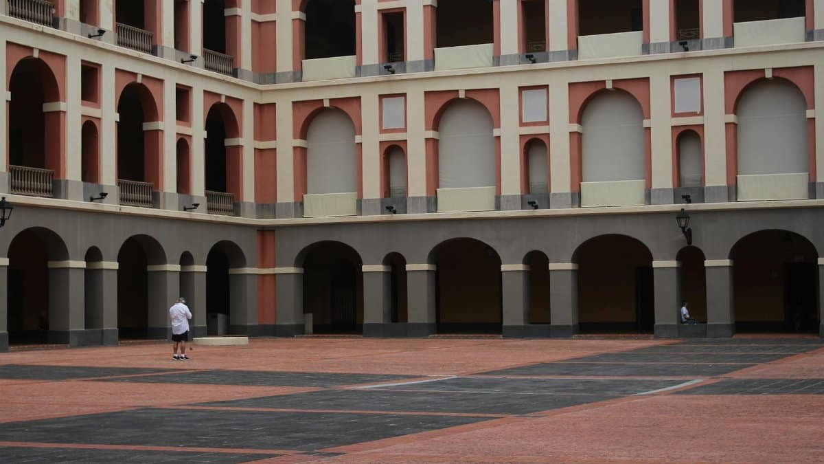 Explore the historic colonial architecture in a vibrant San Juan square, Puerto Rico.