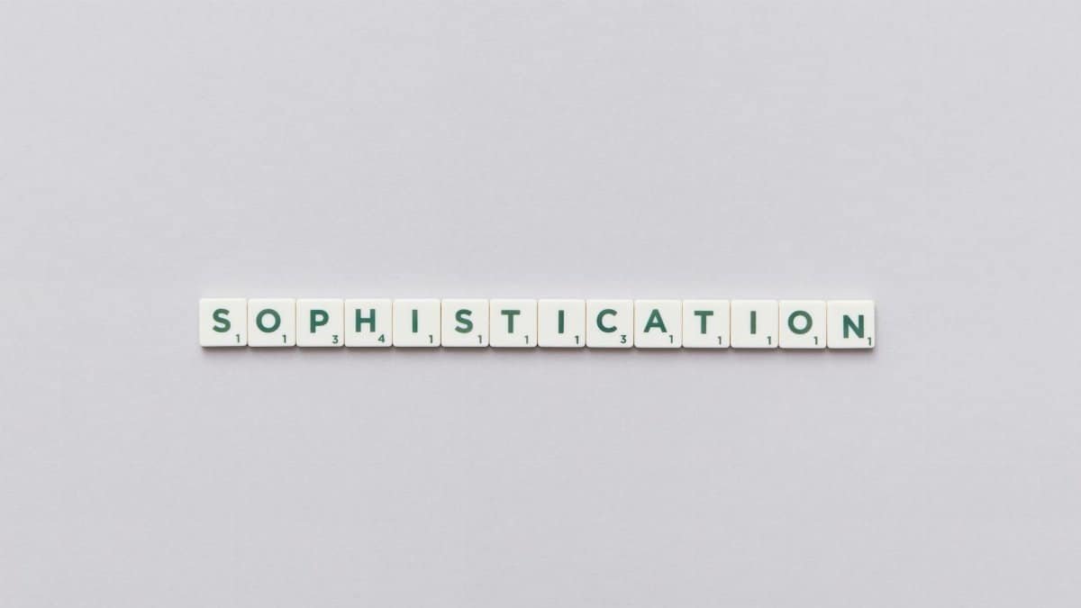 Letter tiles spelling out 'Sophistication' on a neutral background, perfect for conceptual themes.