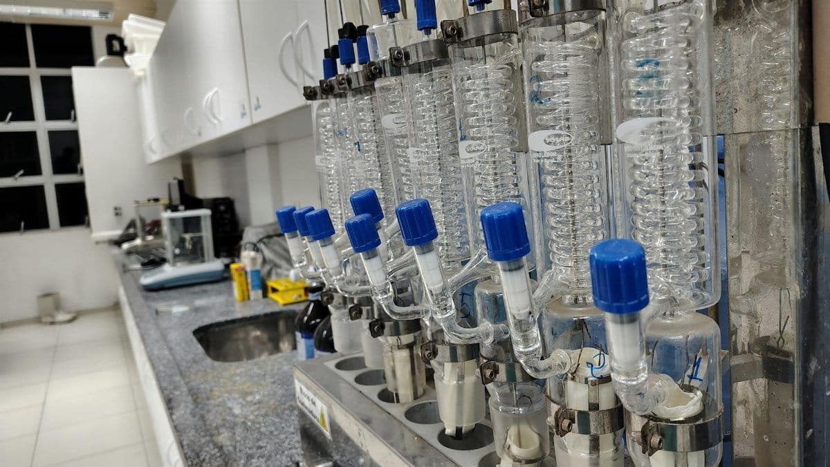Image of a laboratory setup with glass condensers and lab equipment on the countertop.
