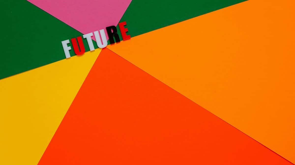 Dynamic abstract image with colorful paper background and 'Future' text.