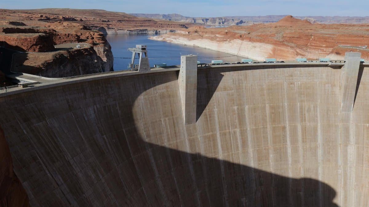 A breathtaking aerial view of Glen Canyon Dam with the Colorado River flowing beneath in Arizona.