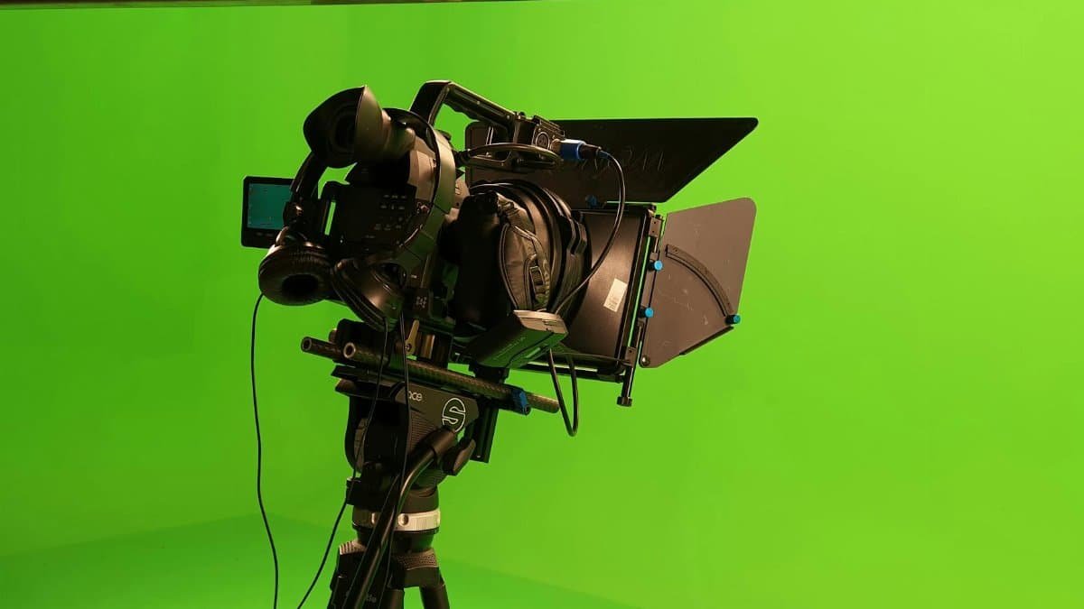 High-quality video camera setup in a green screen studio, ideal for film production.