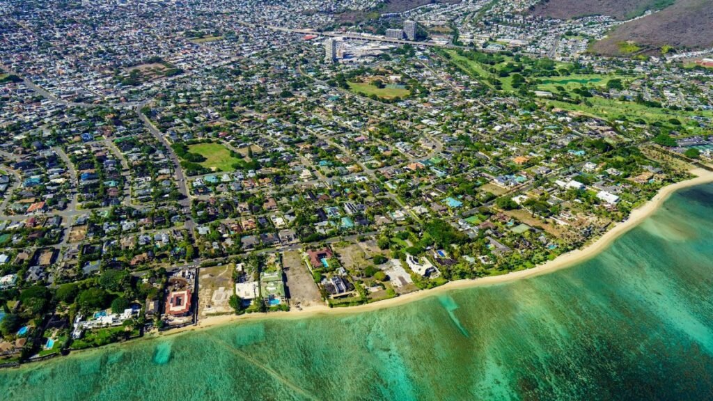 Stunning aerial view capturing Honolulu's coastline and urban sprawl, showcasing beautiful tropical landscapes.