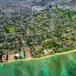 Stunning aerial view capturing Honolulu's coastline and urban sprawl, showcasing beautiful tropical landscapes.