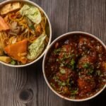 Indulge in a flavorful Indo-Chinese combo of vegetable noodles and spicy Manchurian for a delightful meal.