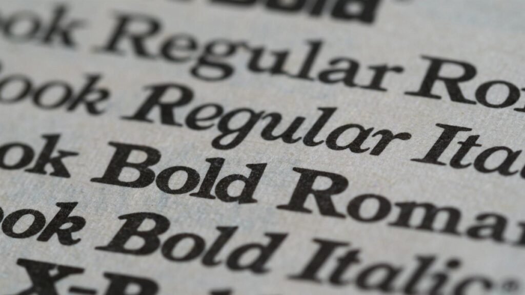 Detailed view of different font styles printed on paper, showcasing typography.