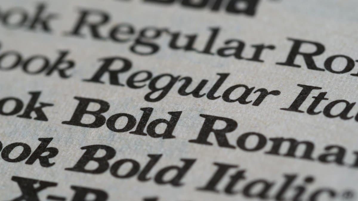 Detailed view of different font styles printed on paper, showcasing typography.