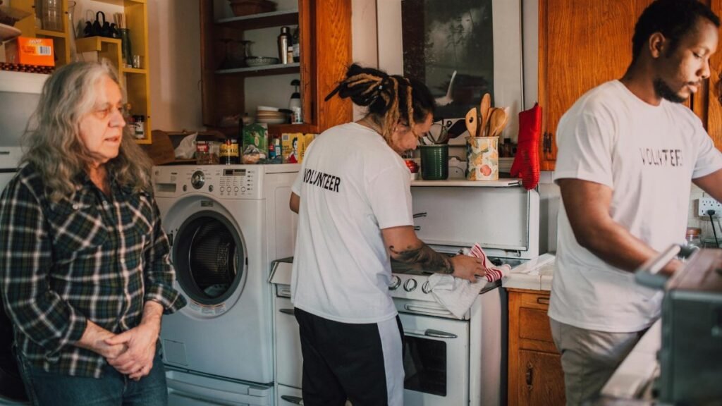 Volunteers preparing food in a community kitchen to support local charity efforts.