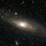 Stunning view of the Andromeda Galaxy surrounded by countless stars in outer space.