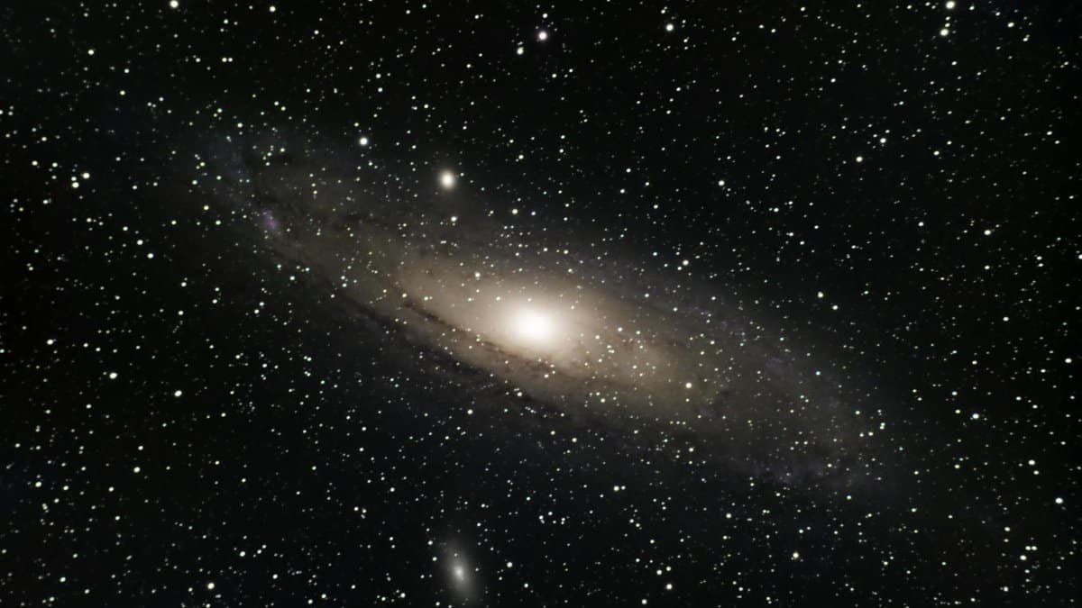 Stunning view of the Andromeda Galaxy surrounded by countless stars in outer space.