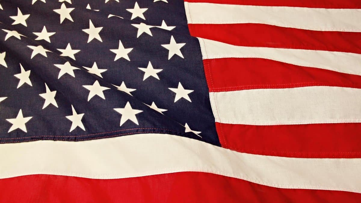 Detailed image of the American flag showcasing the stars and stripes symbolizing USA's patriotism and pride.