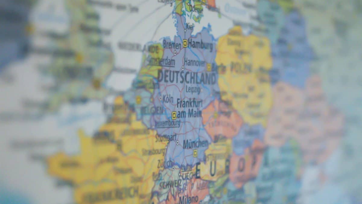 Close-up view of Germany on a colorful world map showing major cities.