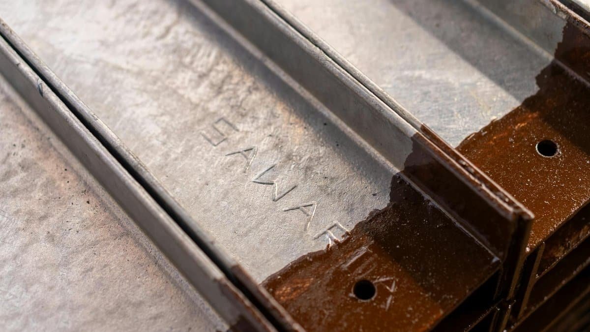 Detailed view of rusty metal rails showcasing texture and industrial style.