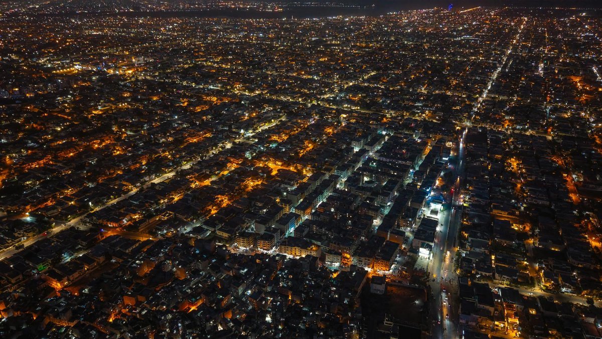 Aerial night shot of Karachi, Pakistan, showcasing the vibrant city lights and urban sprawl.