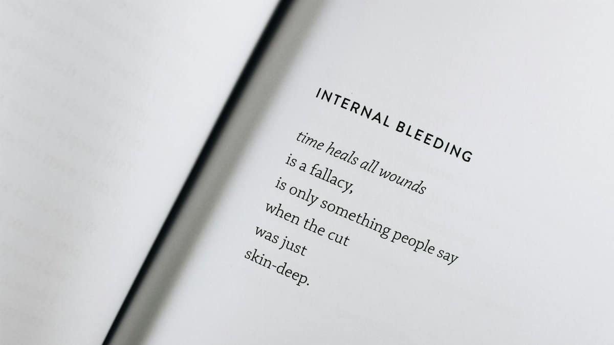 A black text poem on an open white page capturing the essence of healing and reflection.