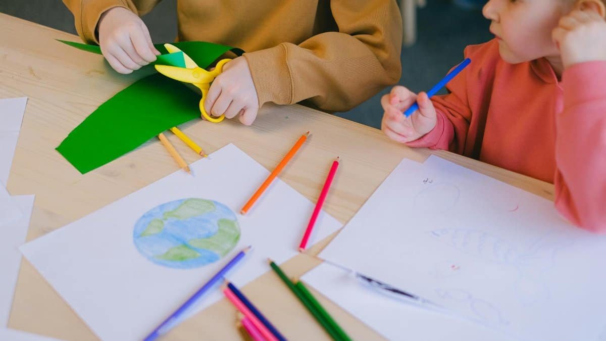 Children explore creativity with drawing and cutting activities focused on ecology.