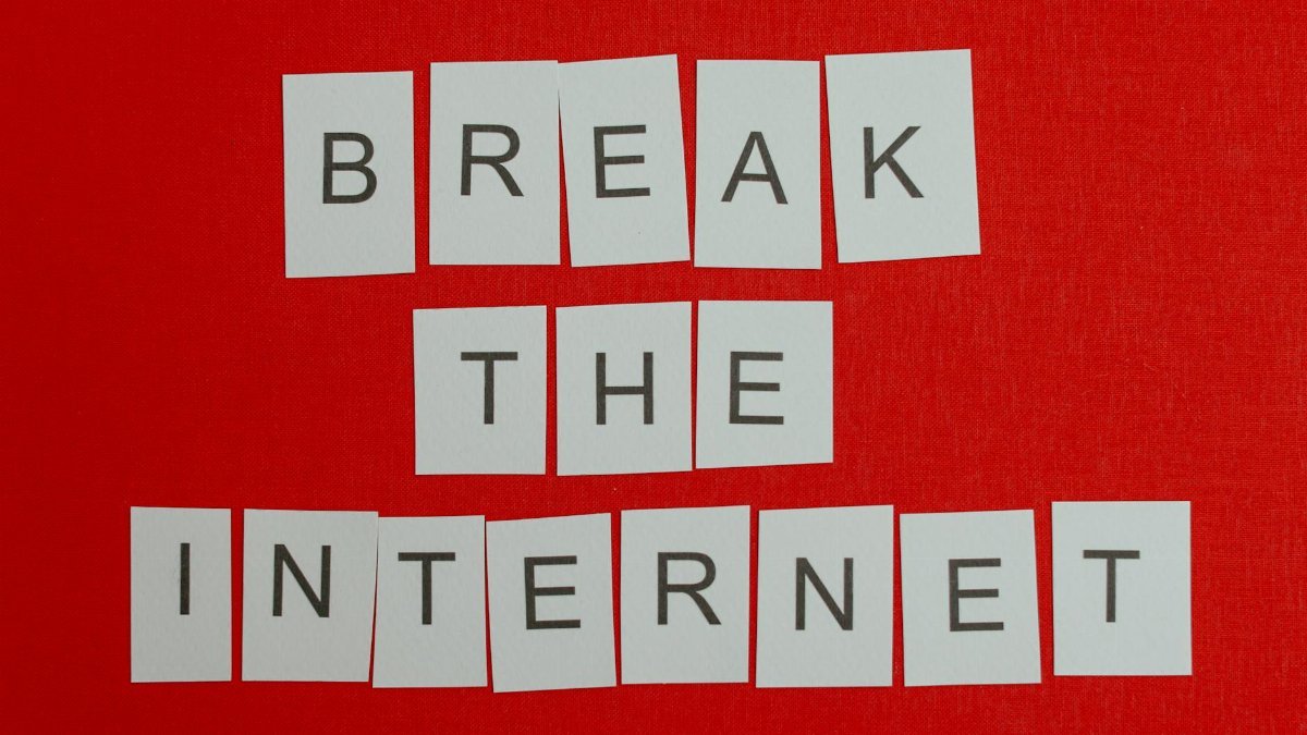 Inspirational message 'Break the Internet' displayed on a vibrant red background.