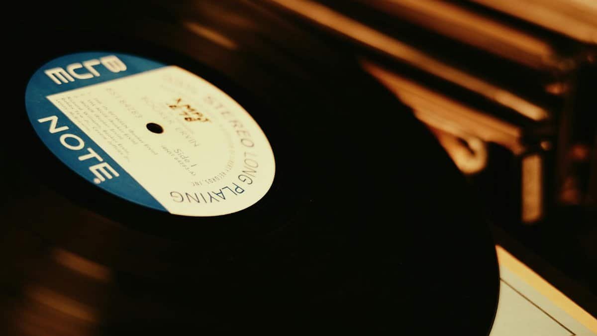 A vintage vinyl record spinning on a classic turntable, highlighting its retro charm.