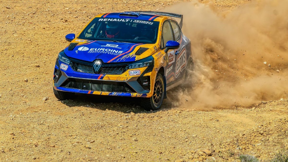 A Renault Clio rally car kicks up dust during a thrilling off-road rally race in Thebes, Greece.