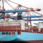 Container ship docked at the Port of Hamburg, showcasing industrial logistics.