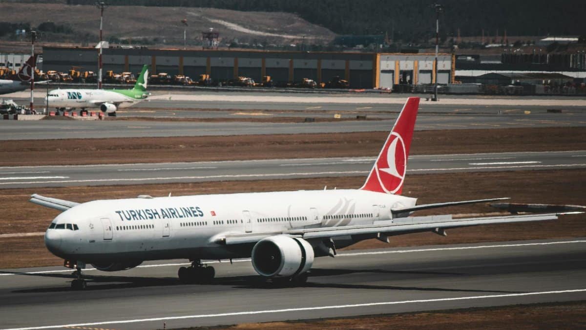 Turkish Airlines aircraft taxiing at Istanbul Airport in Türkiye, showcasing aviation travel.