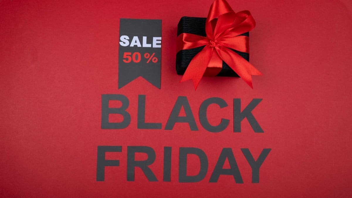 Celebrate Black Friday with a 50% off deal featuring a gift box and vibrant red theme.