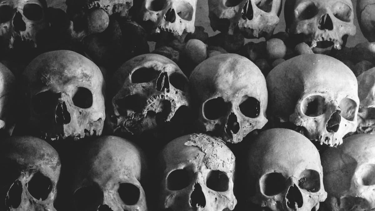 Dark and haunting pile of human skulls creating a creepy atmosphere.