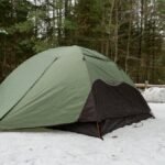A tent set up in a snowy forest at Tahquamenon Falls State Park, Michigan.