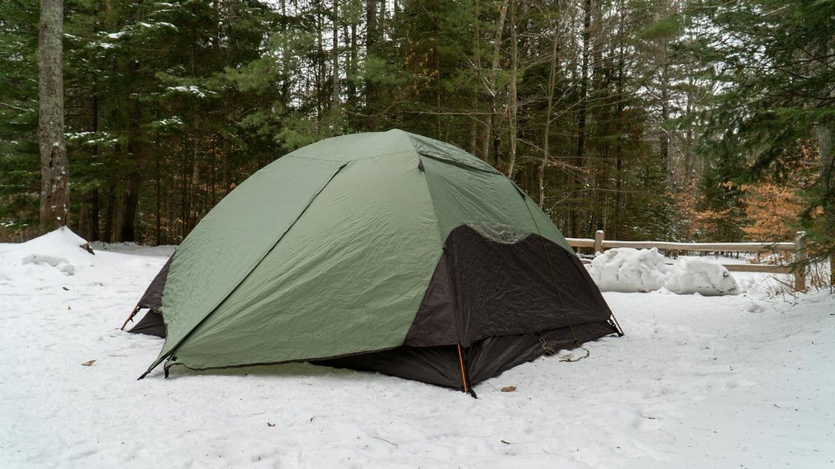 A tent set up in a snowy forest at Tahquamenon Falls State Park, Michigan.
