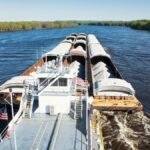 Cargo barge transporting goods on the Mississippi River near Wabasha, Minnesota.
