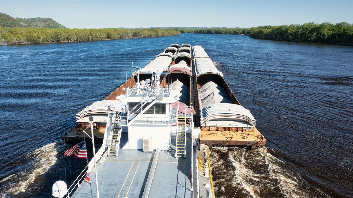 Cargo barge transporting goods on the Mississippi River near Wabasha, Minnesota.