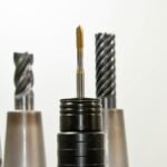 A close-up view of metal drill bits arranged vertically, showcasing industrial tools.