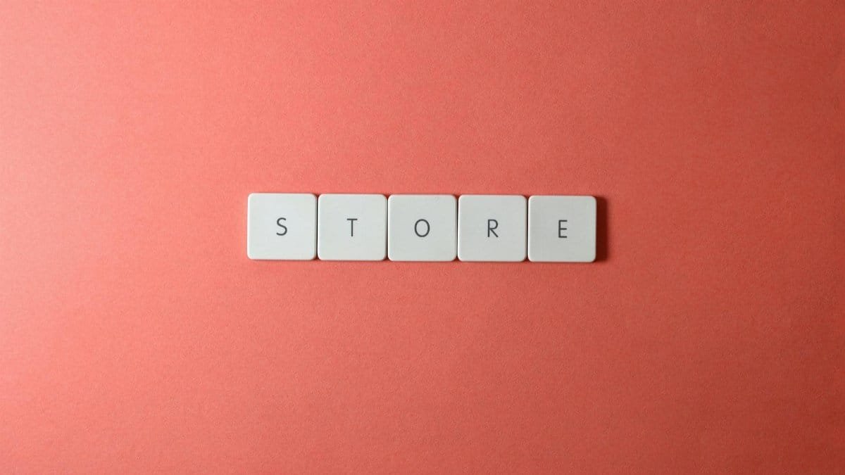 Minimalist conceptual image with 'STORE' spelled out on a red background, perfect for ecommerce themes.