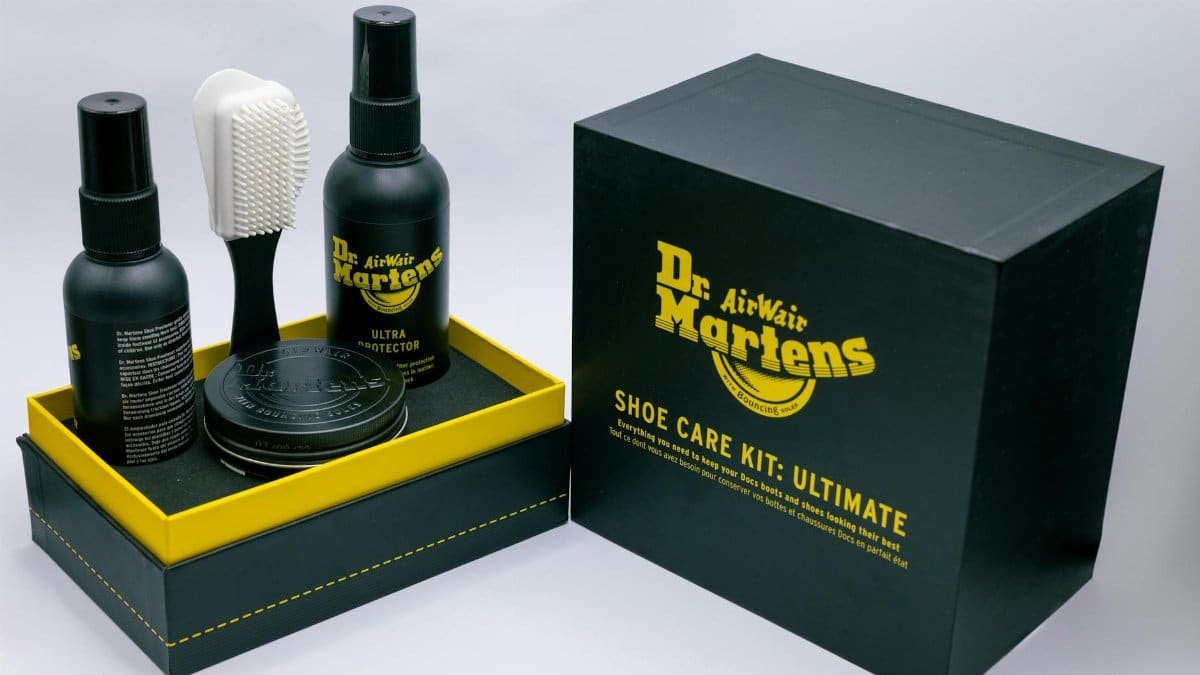 Ultimate Dr. Martens shoe care kit including protector, brush, and wax for leather maintenance.