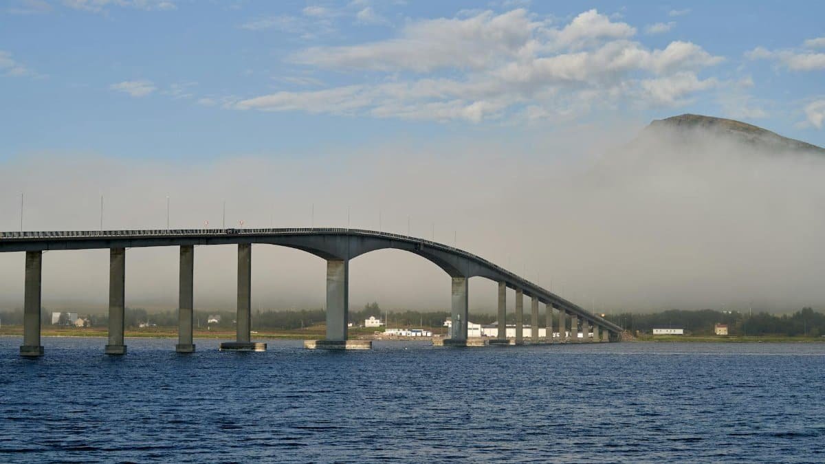 Misty morning view of Sortland Bridge connecting islands in Nordland, Norway.