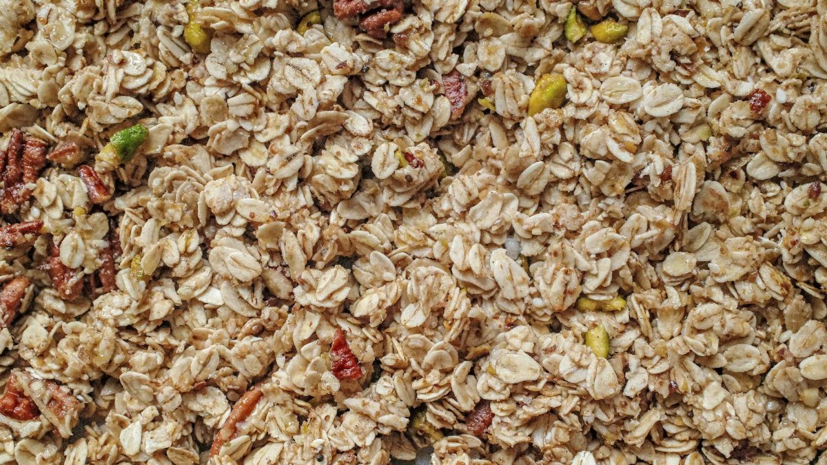 Top view of healthy homemade granola made with oats, nuts, and seeds, perfect for breakfast.