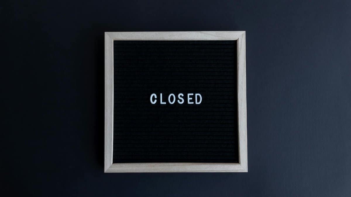 Black letter board with the word 'CLOSED' in white on a dark background.