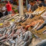 Vibrant seafood market stall showcasing a variety of fresh fish in İzmir, Türkiye.