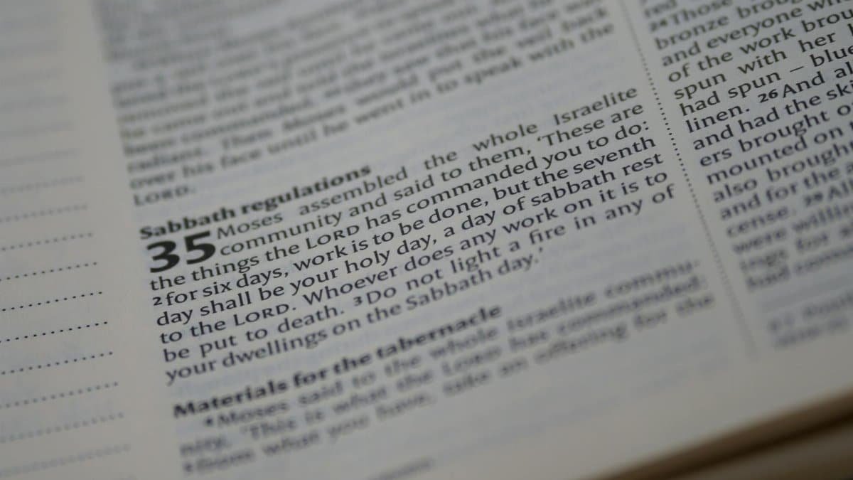 Detailed close-up of a Bible page focusing on Sabbath regulations text.