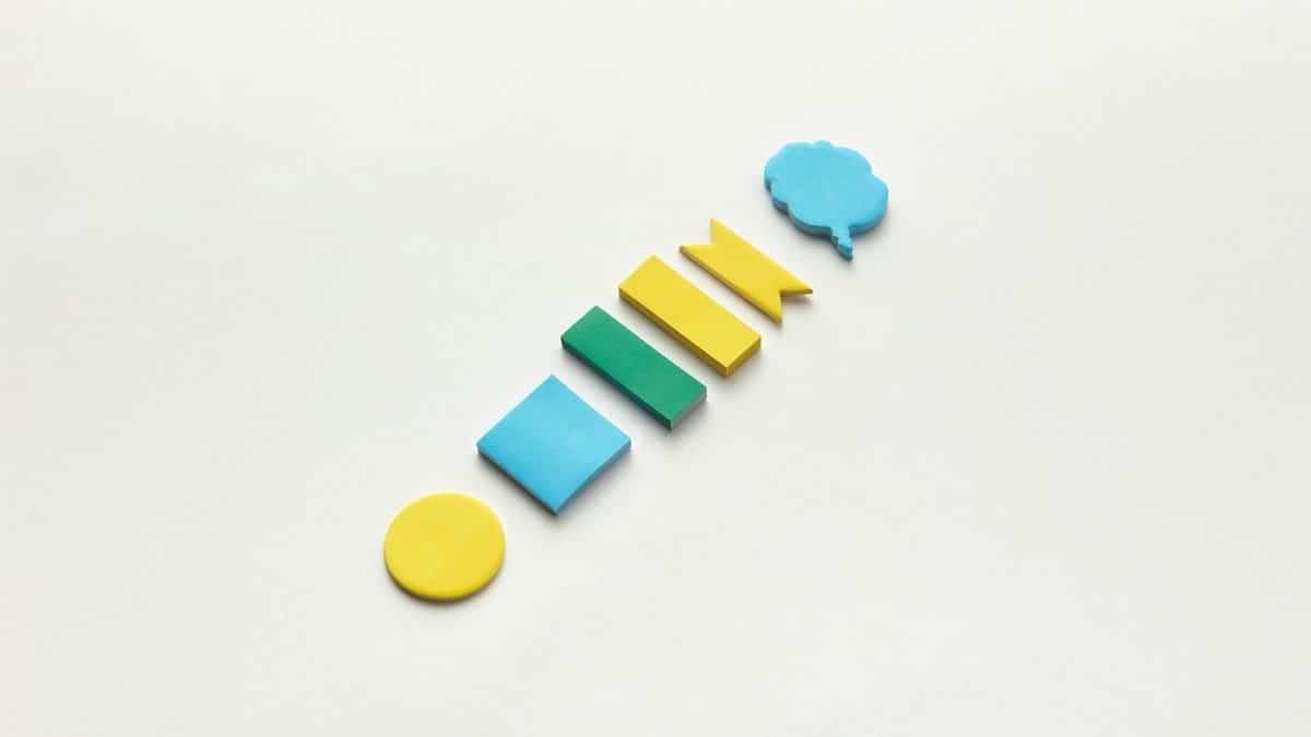 Colorful sticky notes arranged on a white surface, perfect for school and office supplies theme.