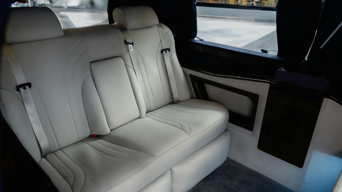 Explore the spacious and luxurious interior of a Mercedes-Benz V-Class, featuring premium white leather seats.