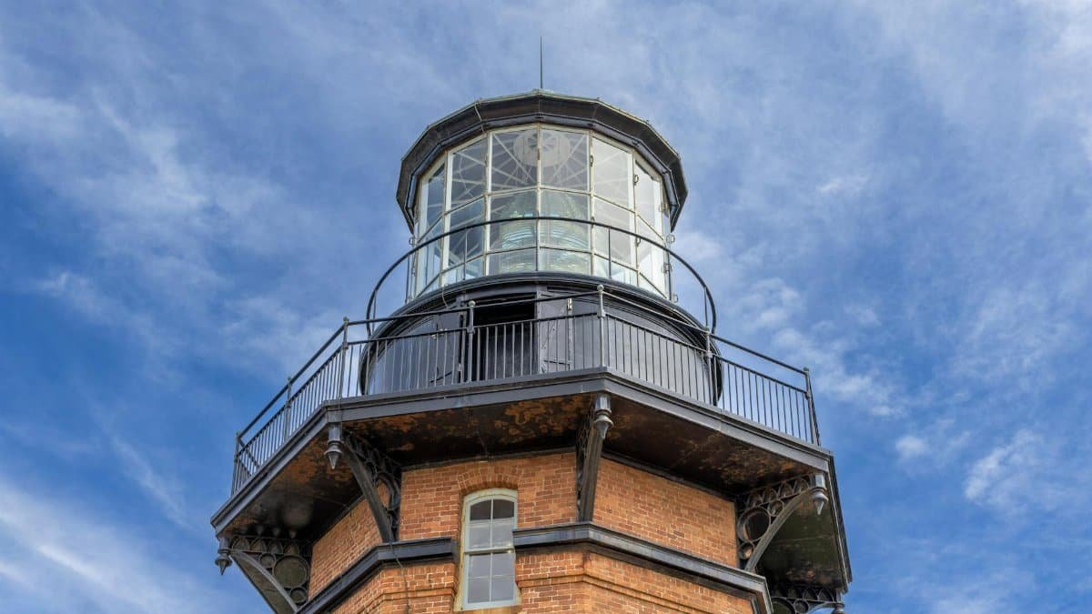 Low angle view of Block Island North Light against clear blue skies in New Shoreham, Rhode Island.