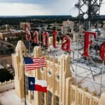 Aerial view of Santa Fe building rooftop with American and Texas flags in Amarillo, Texas.