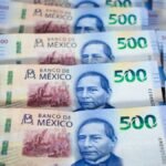 Detail view of multiple Mexican 500 Peso banknotes showcasing currency design and value.
