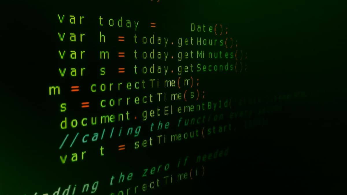 Close-up of JavaScript code on a computer screen with green text highlighting syntax.