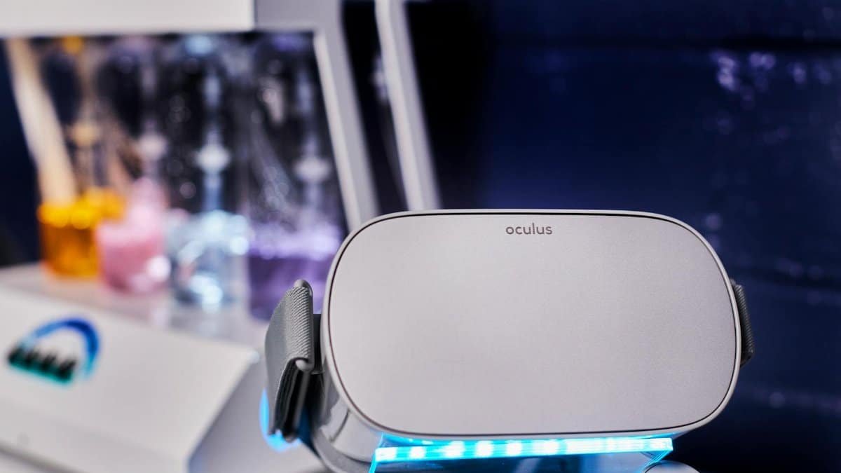 Close-up of a virtual reality headset in a high-tech lab environment with scientific equipment.