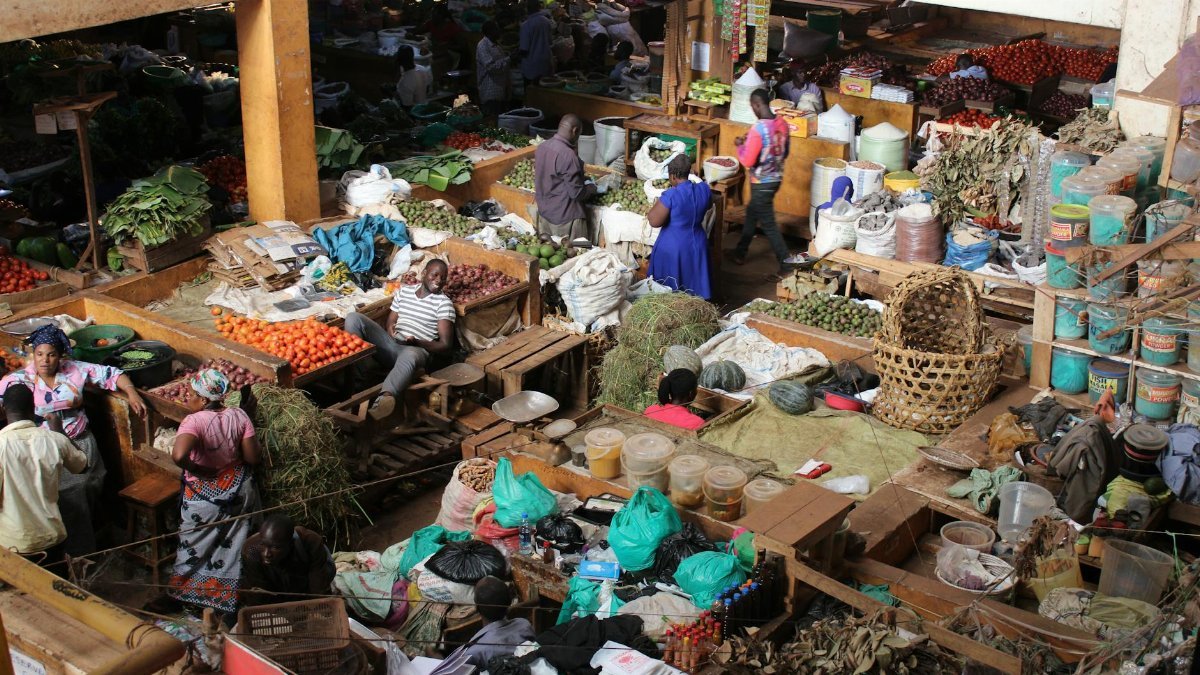 Explore the bustling activity and vibrant colors of Jinja Central Market in Uganda.
