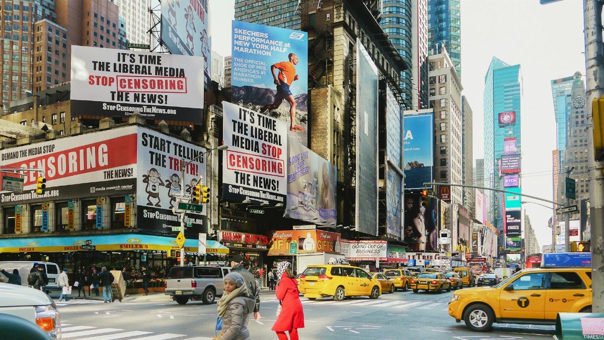 Times Square bustling with taxis and striking billboards. A vibrant downtown scene in New York City.