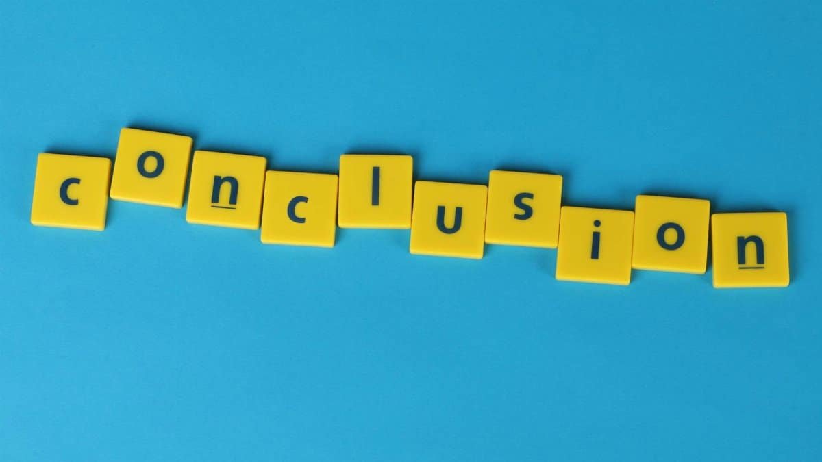 Yellow letter tiles spelling 'conclusion' on a vibrant blue background emphasizing creativity and achievement.